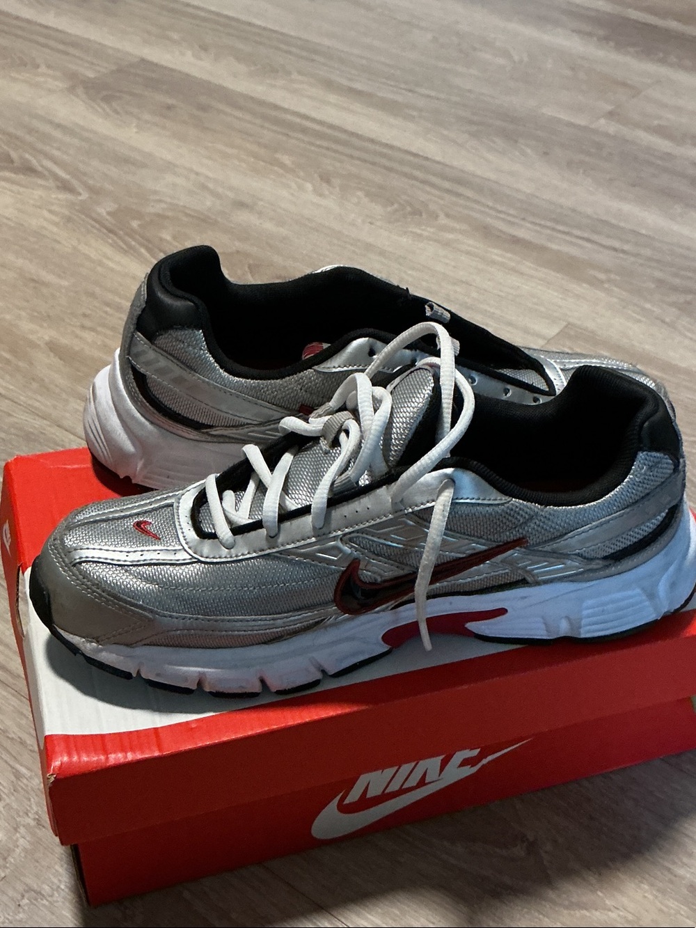 Nike Men’s Silver Sneakers with Red Swoosh